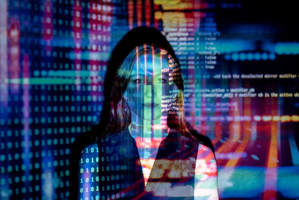 A woman with computer code displayed over her face