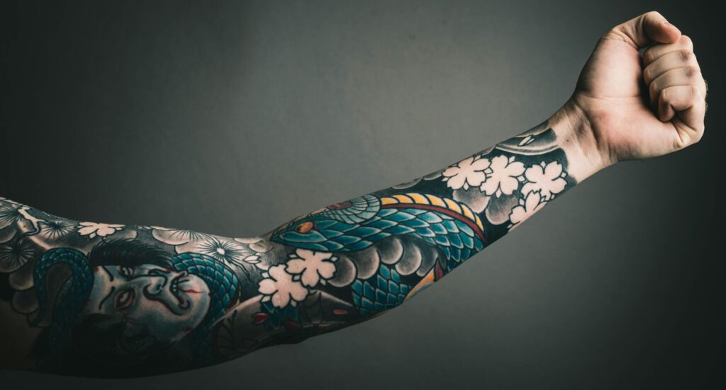 Man's arm with a tattoo - Kevin Bidwell for Pexels.com