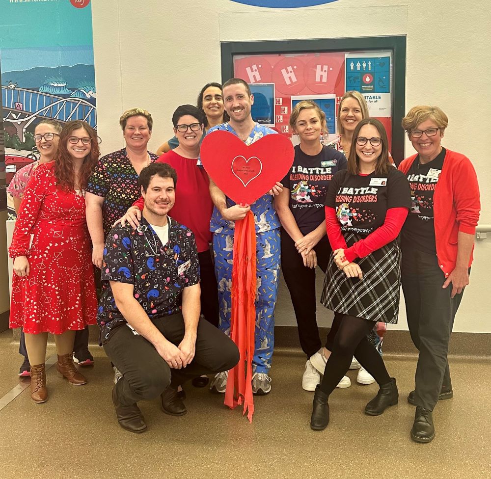 Hospital staff dressed in red with a red heart