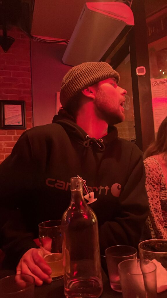 young man drinking at the bar